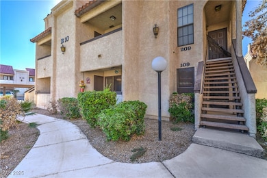 Property entrance featuring stucco siding and a tiled roof