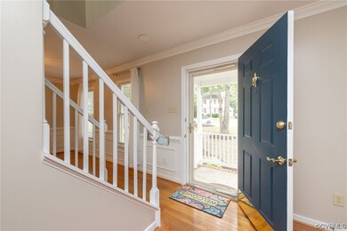 Front entrance w/ hardwood flooring & crown moldin