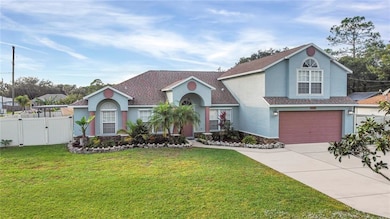 The 2-story home has an attractive stucco facade, 