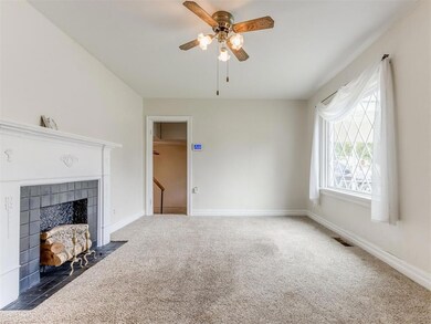 Unfurnished living room featuring carpet floors, c