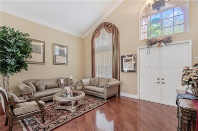 Double, French door entry; large arched windows th