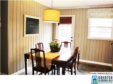 Open Concept Dining Room with new light fixture an