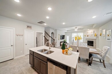 Pantry, powder bath, and utility room are just off
