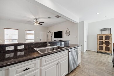 The Kitchen is perfectly situated and opens up into the Living and Dining areas.