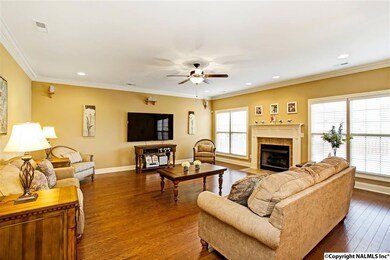 Beautifully finished with heavy crown moulding, hardwood floors, and a gas fireplace, this family room is waiting for you!
