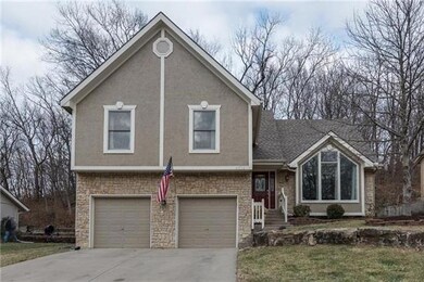 Note all the trees behind the home and fenced yard