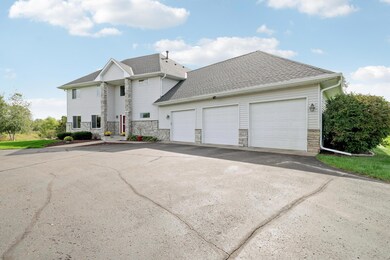 Plenty of room for cars, equipment and toys with this 3 stall oversized garage and a pole building that can store 4 cars.  The attached garage has in floor heat, insulated doors, a sink and floor drain, and an overhead door in the back.