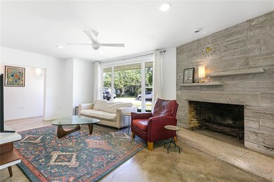 Inviting living space with MCM corner fireplace.