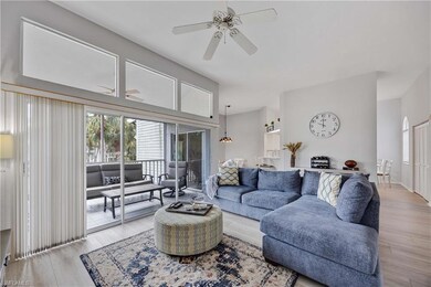 Living room featuring ceiling fan and light hardwood / wood-style floors