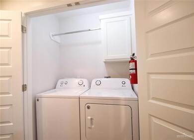 Laundry area with cabinet space and separate washer and dryer