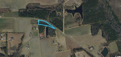 Aerial view of property's location featuring property parcel outlined