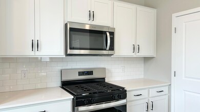 Actual home! Subway tile backsplash, cabinet hardware, soft close cabinet doors and more included with your new kitchen!