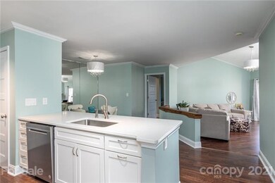 QUARTZ COUNTERTOP, UPDATED STAINLESS DISHWASHER, VIEW OF PANTRY CLOSET.  Removed popcorn ceiling for a smooth finish.