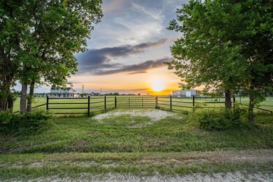 Yard at dusk featuring a rural view