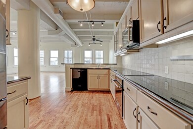 Kitchen is open to living and dining areas, with a