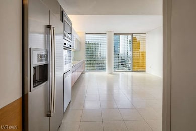 Kitchen with expansive windows, light countertops,