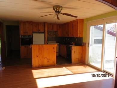 Kitchen/dining features knotty pine...