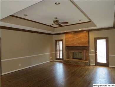 Features a beautiful trey ceiling.  Wooden, staine
