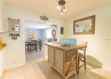 This is the eat-in area in the kitchen and a view of the formal dining room in the rear of the picture.