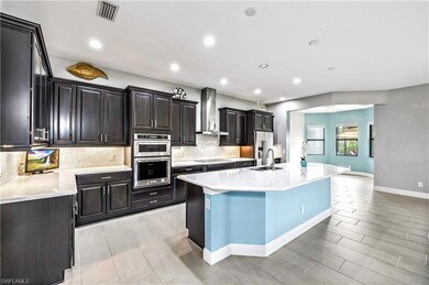 The spacious chef's kitchen boasts KitchenAid appl