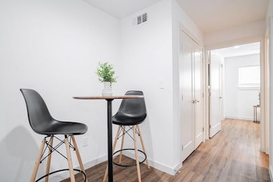 Dining area with light hardwood / wood-style floor
