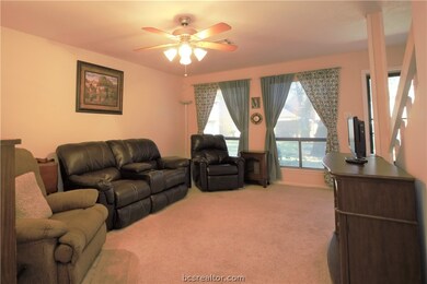 The large family room has double windows with sola