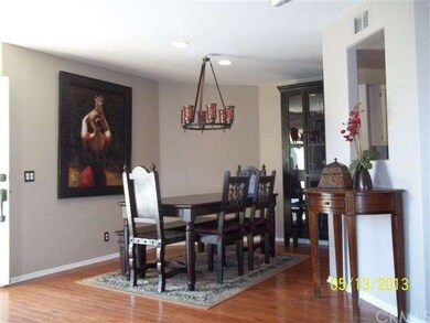 DINING AREA WITH NEUTRAL PAINT & WOOD FLOORS