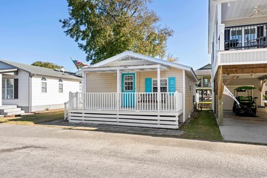 View of front of house featuring covered porch and