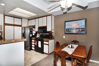 Travertine flooring and granite countertops. 