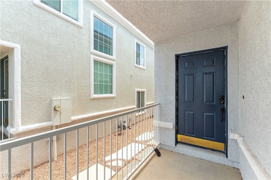 Doorway to property featuring stucco siding and a
