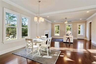 Dining area looking into den with decorator colors