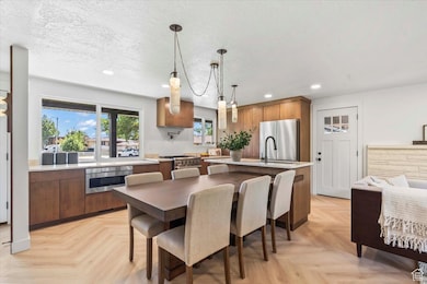 Dining area with recessed lighting and a textured ceiling