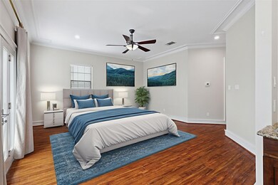 Bedroom with attic access, ornamental molding, wood finished floors, recessed lighting, and ceiling fan