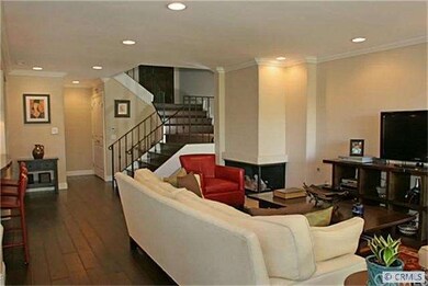 Wide hardwood plank flooring is used throughout th