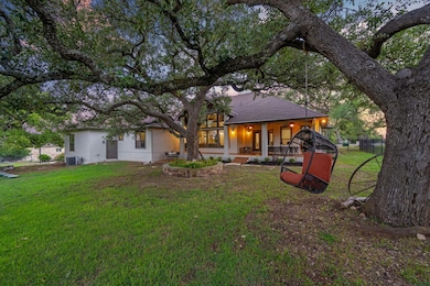 Rear view of property featuring covered porch and
