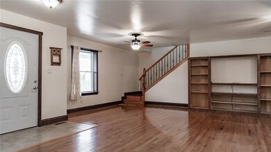 Gleaming hardwood floors throughout the open-conce