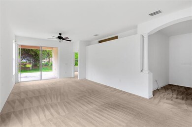 Another View of Living Room looking to Covered Patio, Backyard and Master Bedroom to the far Right. Formal Dining Room/Den Area to the immediate Right