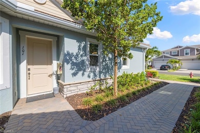 Doorway to property featuring stucco siding