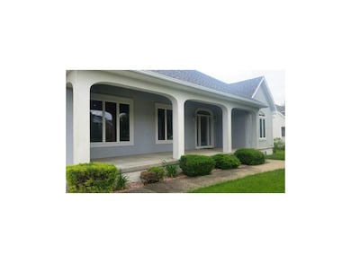 Inviting covered concrete porch