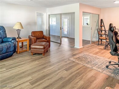 Living area with wood finished floors and a textur