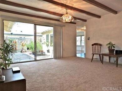 Beamed ceiling and sliding doors to atrium.