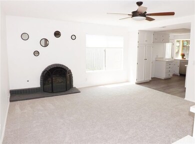 The newly remodeled family room features new carpe