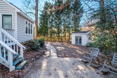 Fenced in back yard with shed on corner lot.
