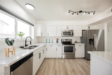 Kitchen featuring appliances with stainless steel