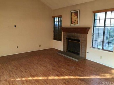 Living room with laminate wood flooring.  Lots of 