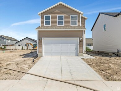 Traditional-style house featuring driveway and a garage