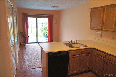Eat-in kitchen with door to the back patio and dec