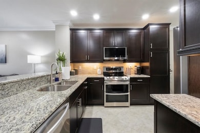 15114 Palmer Lake Cir unit 104, Naples, FL 34109 - photo 2