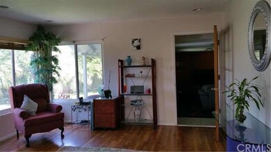 Living room with french door entry to bonus area a