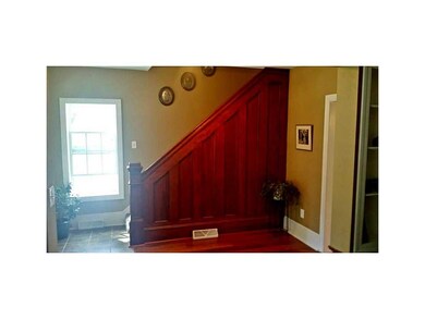 Foyer. All new ceramic flooring in entryway, refin